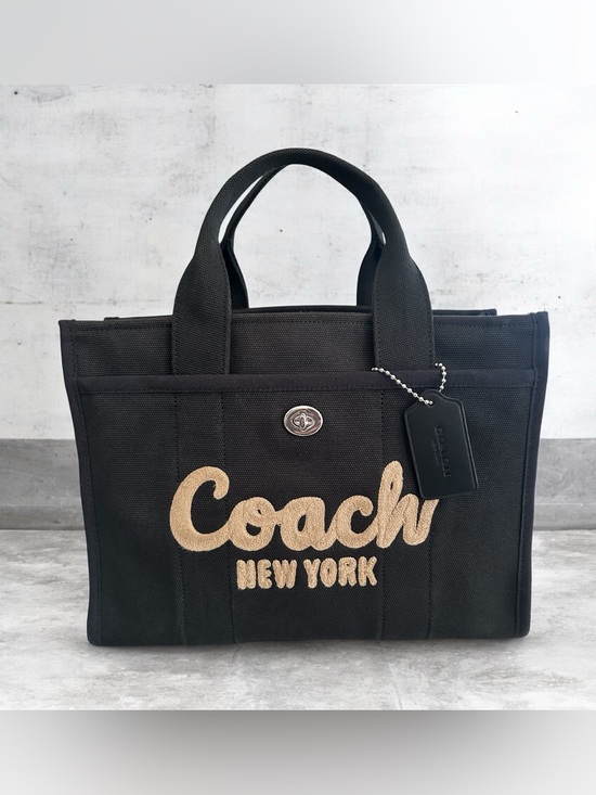 Coach Handbags - Coach Black Canvas Tote with Tan Embroidered Logo